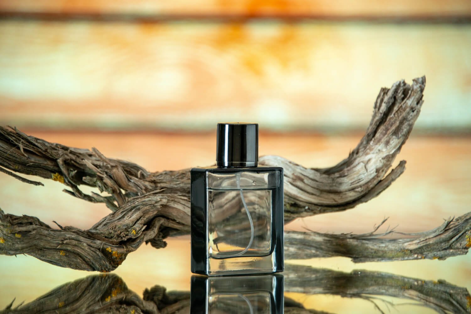 a niche perfume with a wood in the background